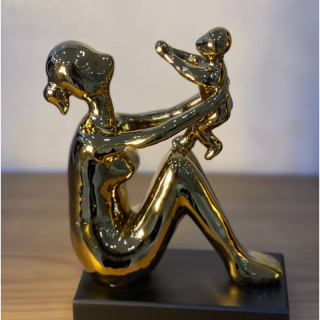 Mother and child gold figurine